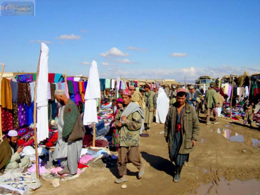 People Walking in Clothing Market